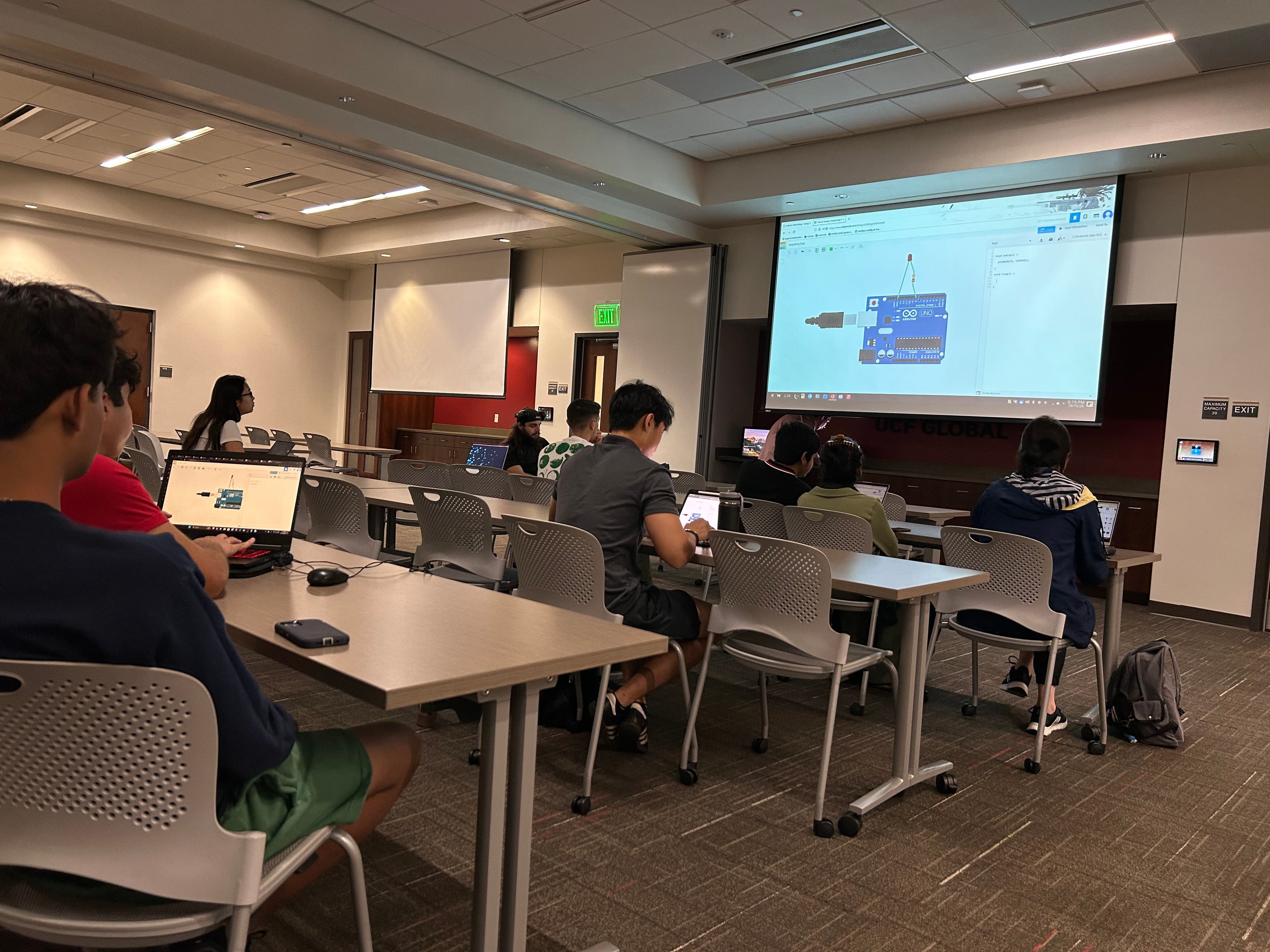 SASE members working on laptops during an Arduino and breadboard workshop